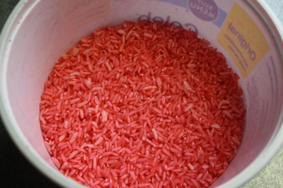 dyed red rice for sensory play 