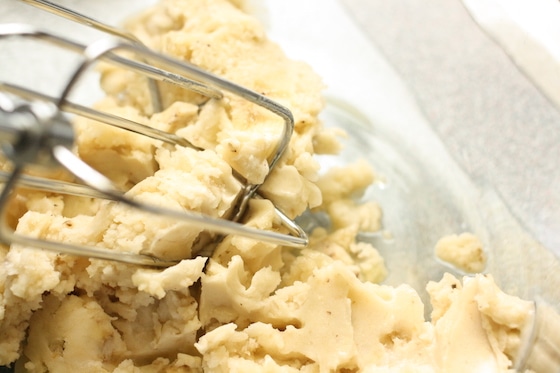 blending frozen bananas with electric mixer