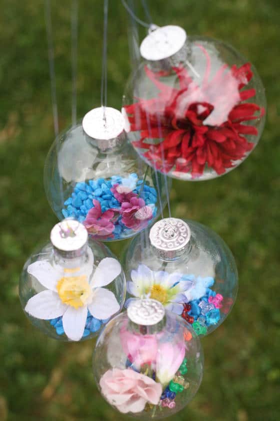 glass ornaments filled with coloured rocks and flowers