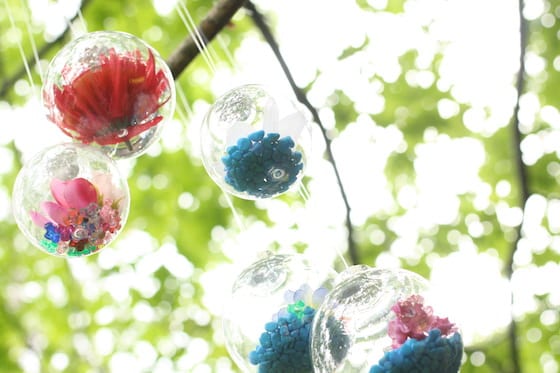 Flower drop ornaments hanging in tree