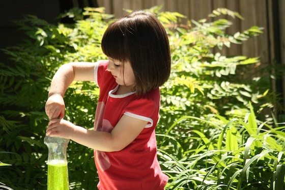 popping top on squeeze bottle - fine motor