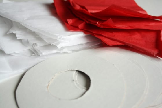 small cardboard wreath, red and white tissue paper cut into squares