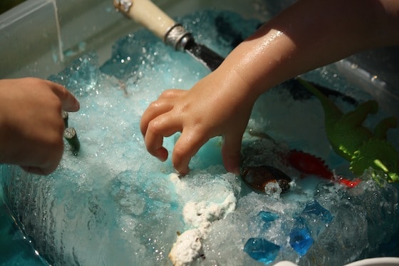 dino dig: science activity. digging toys out of an ice block