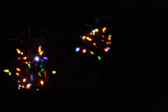 two lighted christmas balls photographed at night 