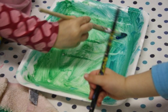 painting styrofoam trays for a spring toddler art project