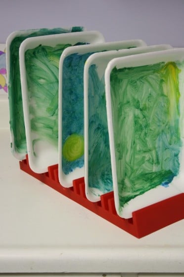 painted styrofoam trays drying in rack