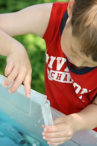 playing with plastic test tubes