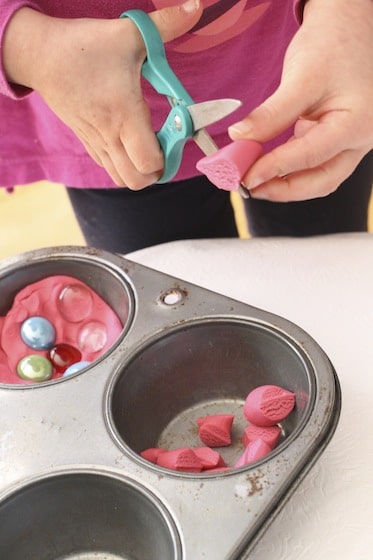 cutting play dough with scissors