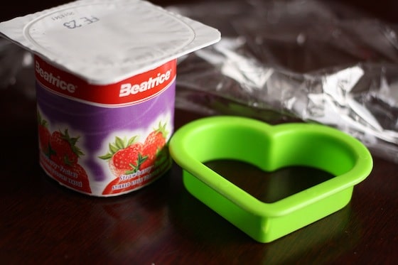 yogurt, cookie cutter and plastic wrap