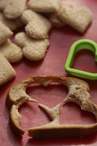 Cookie cutter and bread slices to make heart shaped french toast.