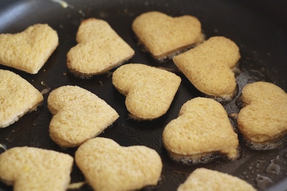 Frying French Toast hearts in butter.