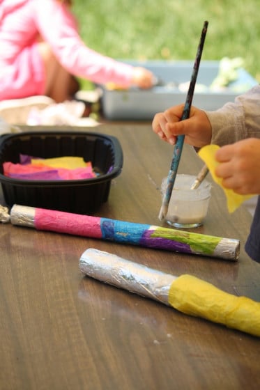 toddlers and preschoolers painting rain sticks