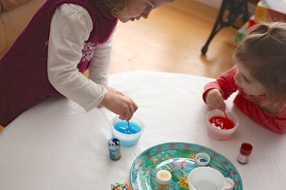 children mixing food colouring and water