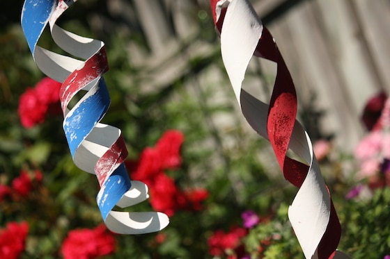 homemade wind spinners hanging in garden