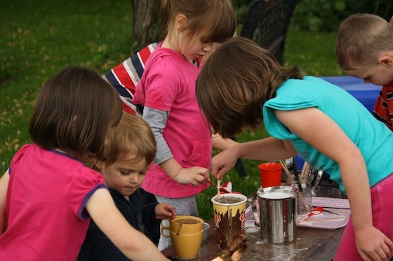 kids ages 1-7 working in a pretend coffee shop