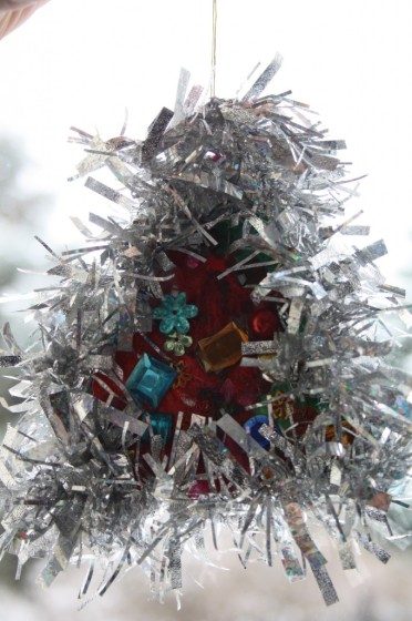 jewelled tree ornament with silver tinsel made by toddler