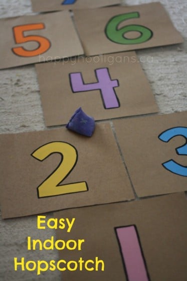 indoor hopscotch made with painted cardboard pieces and beanbag