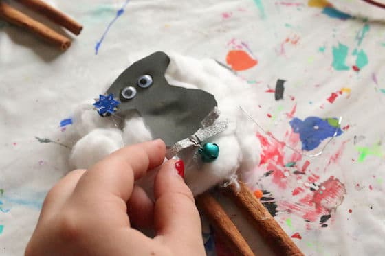 kid making sheep ornament