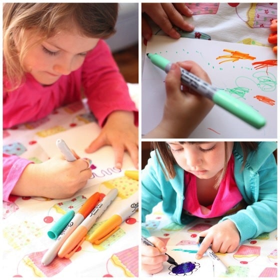 kids colouring with sharpies on photo paper