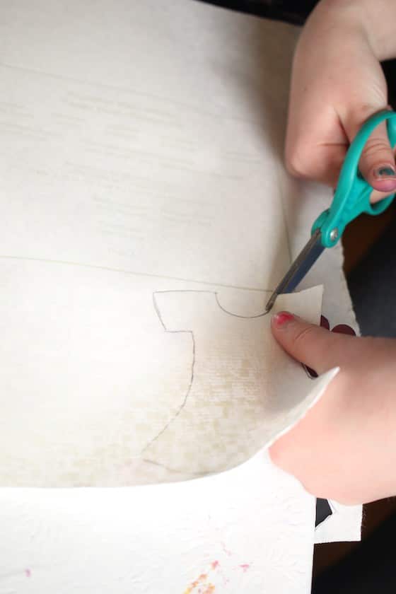 kids cutting dresses out of wallpaper samples