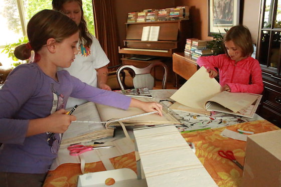 kids measuring for shoebox houses