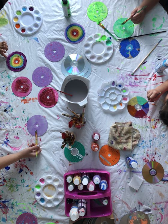 Kids painting CDs with acrylic craft paint