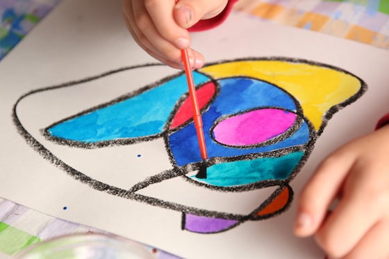 Kids painting pastels with watercolors