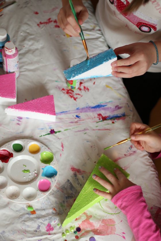 kids painting styro Christmas trees