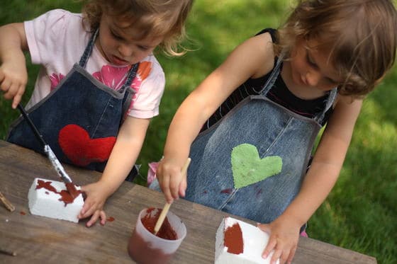 kids painting styrofoam blocks