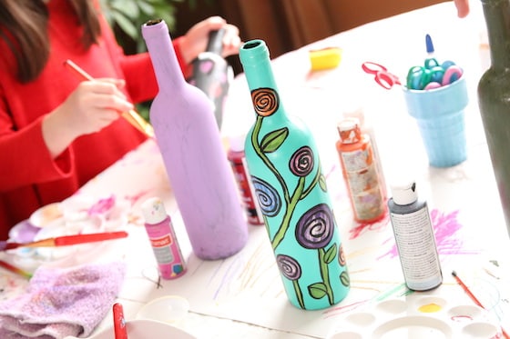 kids painting wine bottles for Mother's Day Gift