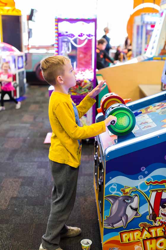 kids playing games at Chuck E. Cheese's