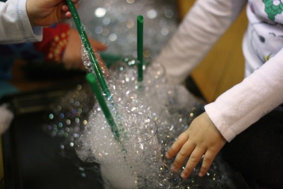 kids playing with soap bubbles