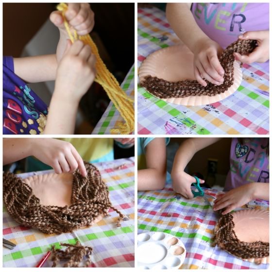 kids putting yarn hair on paper plate face craft