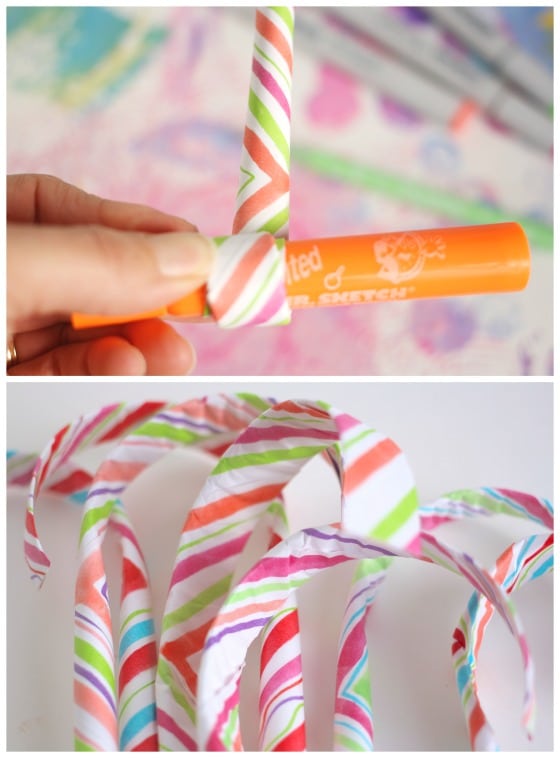 rolling up paper candy cane