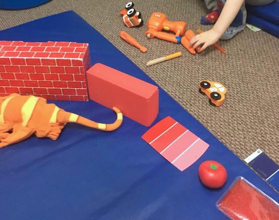 making rainbow from coloured toys