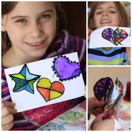 Kids showing finished Sharpie and Photo Paper Hearts