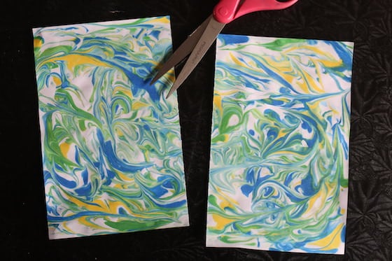 Marbled paper cut in half for snowflake craft