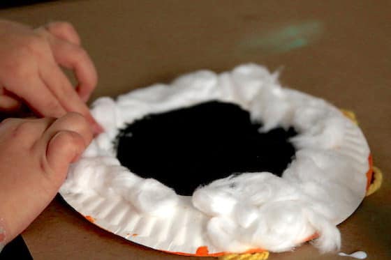 Making a lamb with paper plate and cotton balls