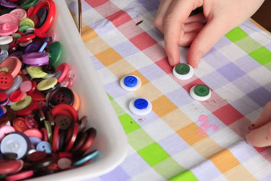 Making googly eyes out of buttons 