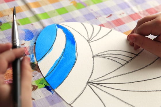 paper egg decorated with crayon and watercolours