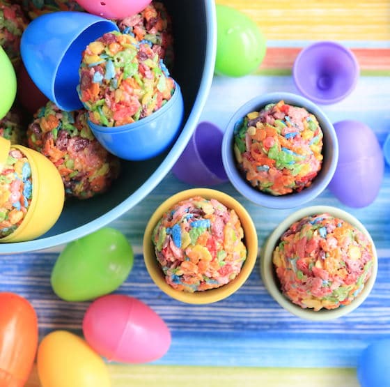 Overhead view of bowl and egg cups filled with colourful easter treats