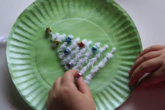 adjusting beads on yarn christmas trees