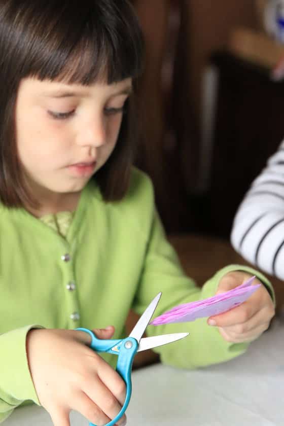 Cutting a snowflake from a coffee filter