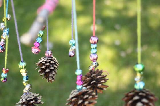 mobile-craft-with-sticks-pinecones-yarn-and-beads