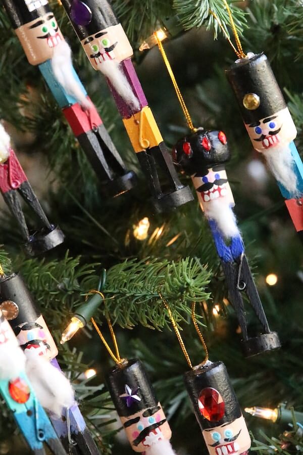 8 homemade nutcracker ornaments hung on Christmas Tree