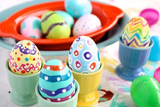 painted eggs in egg cups