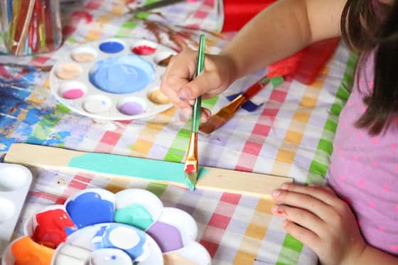 painting a paint stir stick