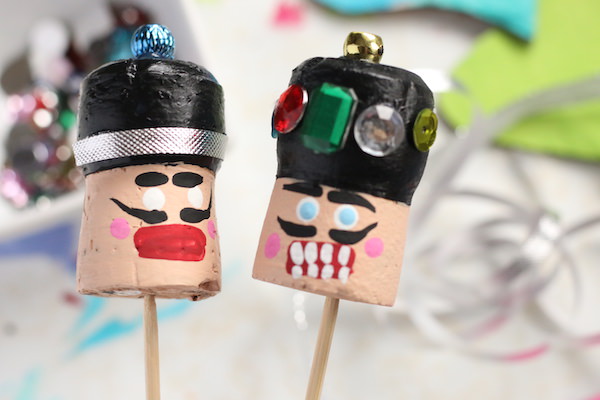 painting faces cork nutcrackers