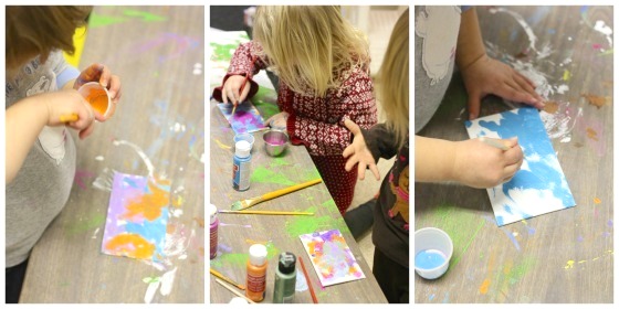 toddlers painting fridge magnets