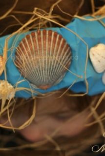 paper bag mermaid crown on girl's head